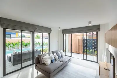 Modern living room with pool view and stylish decor