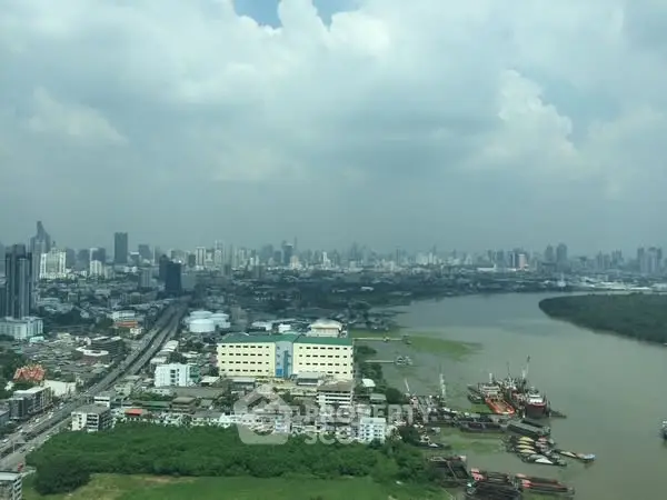 Stunning cityscape view with river and skyline, perfect for urban living enthusiasts.