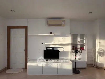 Modern living room with minimalist furniture and air conditioning unit