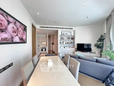 Modern open-plan living and dining area with stylish decor and natural light