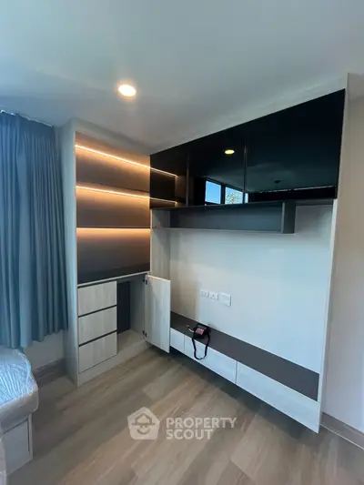 Modern bedroom with built-in storage and sleek design