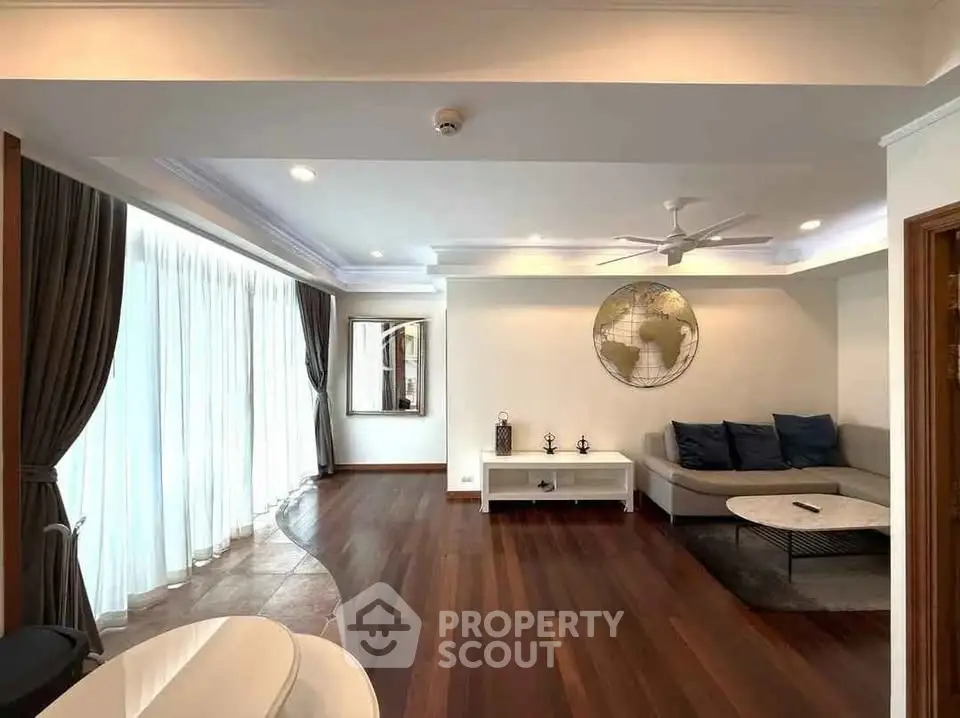 Spacious living room with elegant hardwood floors and modern decor