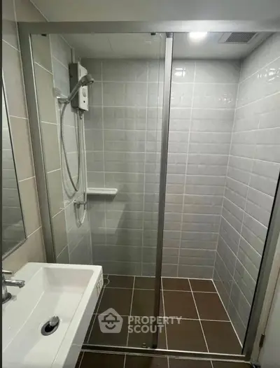 Modern bathroom with sleek shower enclosure and stylish tiles