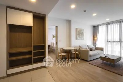 Modern living room with stylish furniture and natural light in a contemporary apartment.