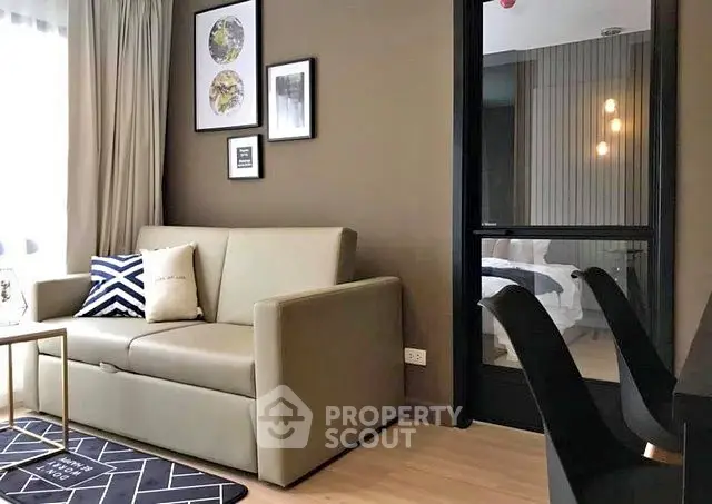 Modern living room with stylish decor and cozy seating in a contemporary apartment.