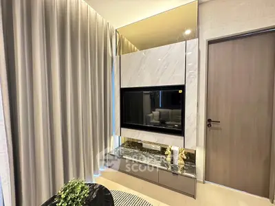 Modern living room with elegant marble TV wall and stylish decor