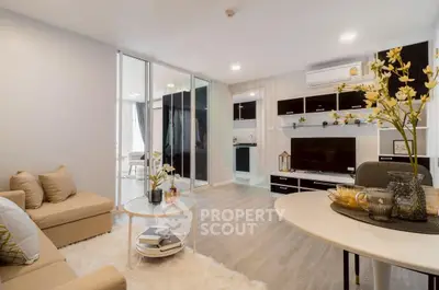 Modern living room with open layout and stylish decor in a contemporary apartment.