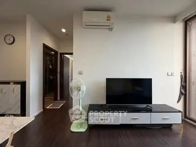Modern living room with sleek TV stand and air conditioning
