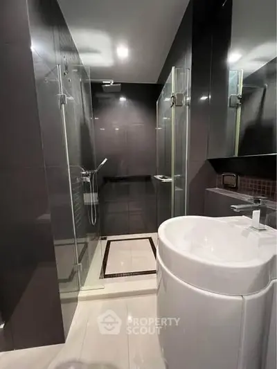 Modern bathroom with sleek design and glass shower enclosure