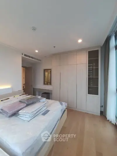 Spacious bedroom with modern design and ample natural light