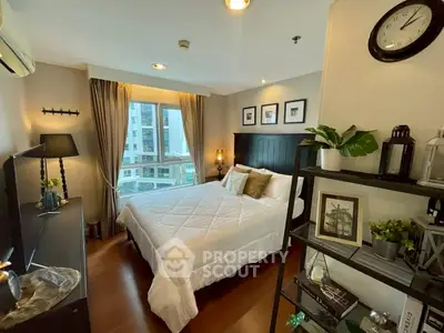 Cozy and stylish bedroom with modern decor and large window view.