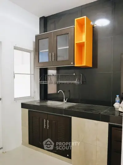 Modern kitchen with sleek cabinets and open layout design