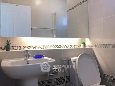 Modern bathroom with sleek fixtures and stylish tile accents