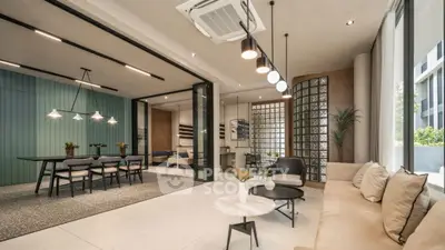 Modern living room with elegant decor and spacious dining area