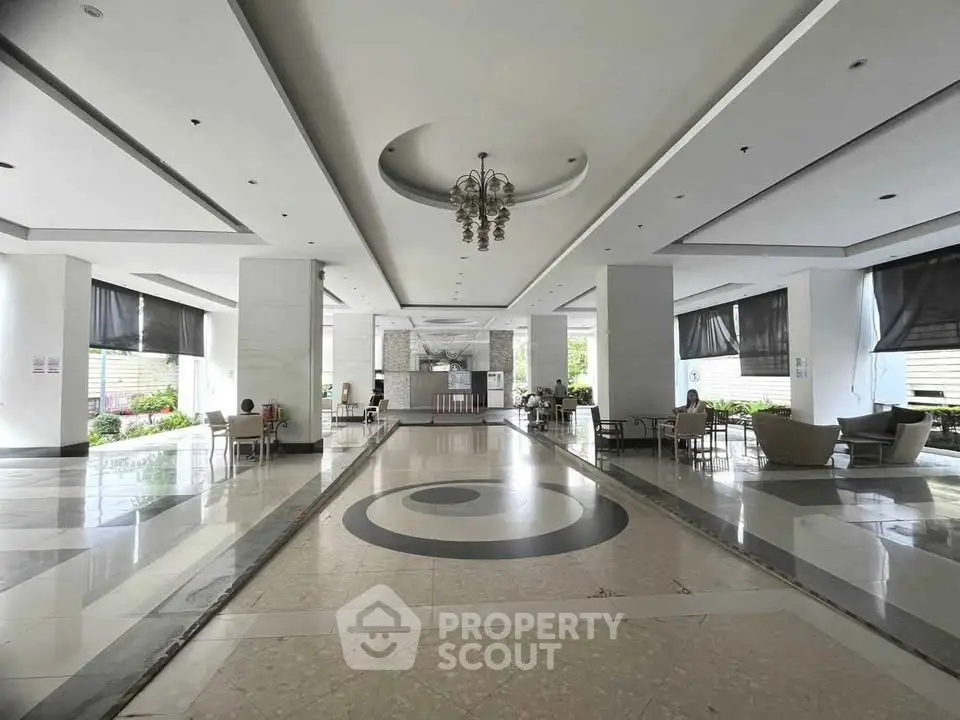 Spacious and elegant building lobby with modern design and ample seating areas.