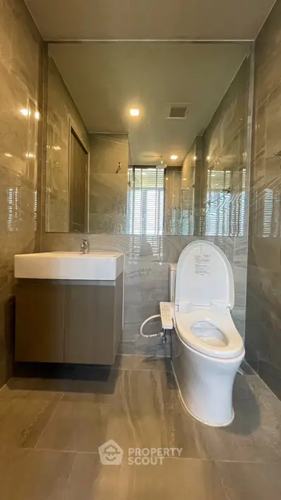 Luxurious modern bathroom with sleek fixtures and elegant marble tiles