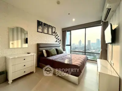 Modern bedroom with city view, featuring stylish decor and large windows for natural light.
