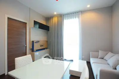 Modern living room with sleek furniture and natural light