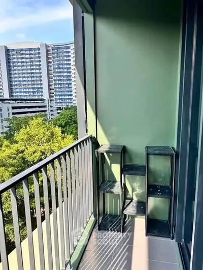 Charming balcony with city view, perfect for relaxation and enjoying the outdoors.