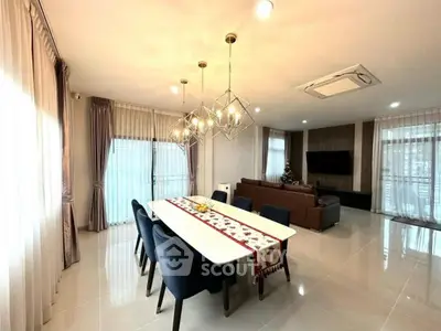 Spacious modern living room with elegant dining area and stylish lighting