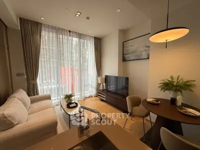 Modern living room with elegant decor, large window, and cozy seating area in a stylish apartment.