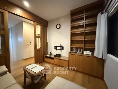 Cozy living room with wooden shelves and modern decor