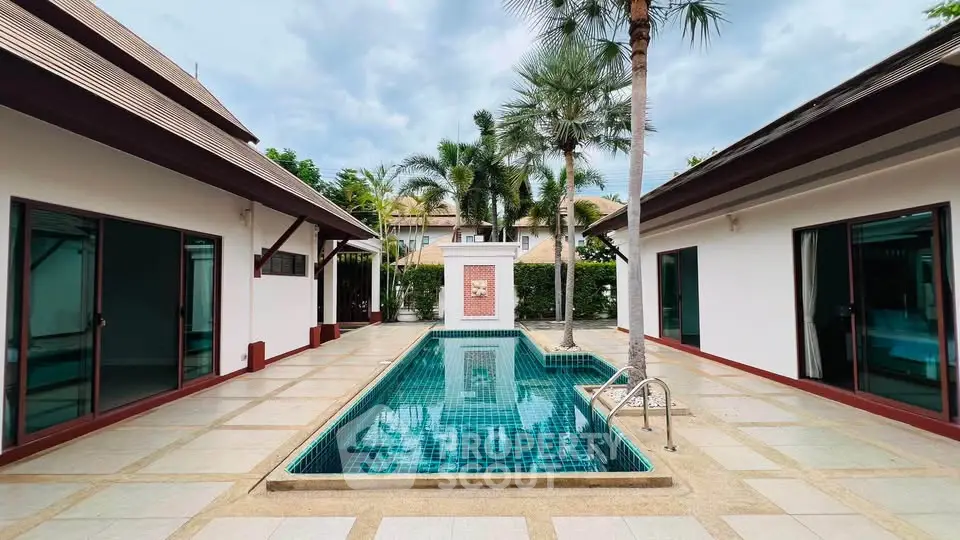 Luxurious villa with private pool and tropical landscaping, perfect for serene living.