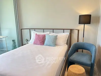 Modern bedroom with stylish decor and cozy ambiance, featuring a comfortable bed and elegant lighting.