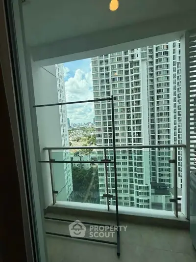 Modern balcony with city view in high-rise apartment building