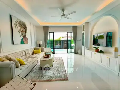 Luxurious living room with elegant decor and pool view