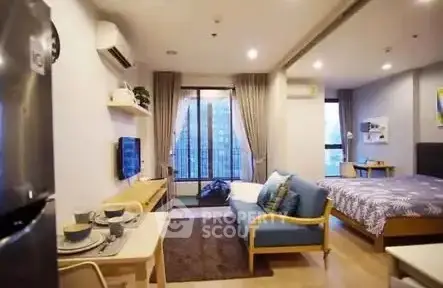 Modern open-plan studio apartment with stylish decor and city view.