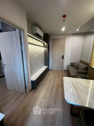 Modern living room with sleek design and wooden flooring