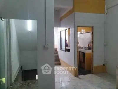 Spacious interior with tiled floors and open layout, ideal for modern living.