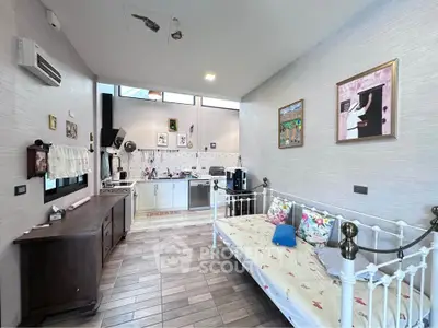 Charming open-plan living area with cozy decor and modern kitchen