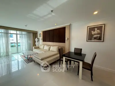 Spacious living room with modern decor and large windows for natural light.