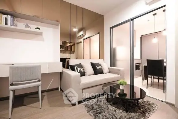 Modern living room with stylish decor and cozy seating area in a contemporary apartment.