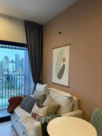 Cozy living room with modern decor and city view balcony, perfect for urban living.