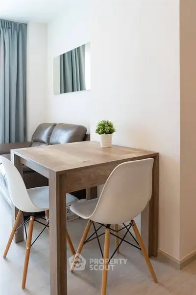 Modern living room with cozy seating and stylish dining area