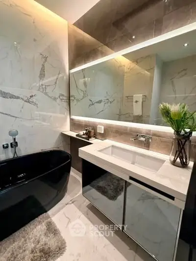 Luxurious modern bathroom with elegant black bathtub and stylish vanity