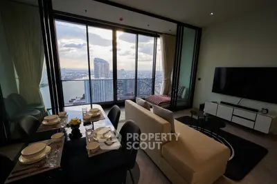 Luxurious living room with stunning city view, modern furniture, and elegant dining area.