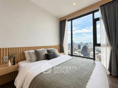 Luxurious bedroom with stunning city view and modern decor