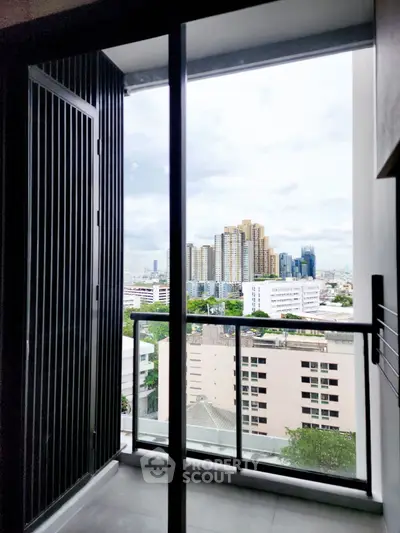 Stunning city view from a modern balcony in a high-rise apartment, perfect for urban living.