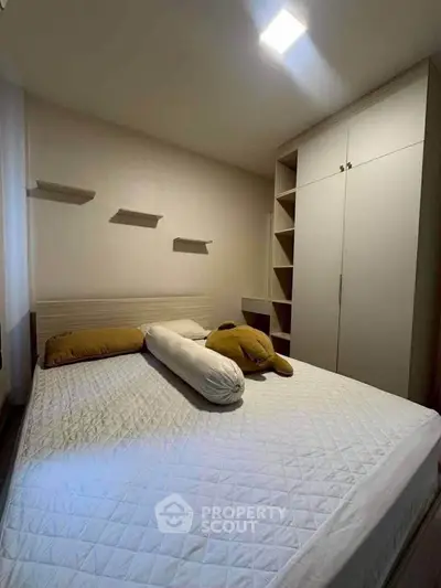 Cozy bedroom with modern wardrobe and minimalist decor