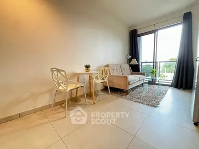 Modern living room with stylish furniture and large window view