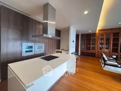 Luxurious open kitchen with modern appliances and elegant wooden flooring