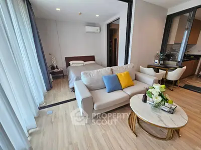Modern studio apartment with cozy living area and elegant decor