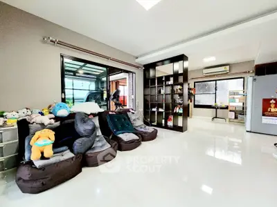 Spacious modern living room with plush seating and open layout, perfect for family gatherings.