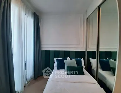 Cozy bedroom with elegant decor and mirrored wardrobe