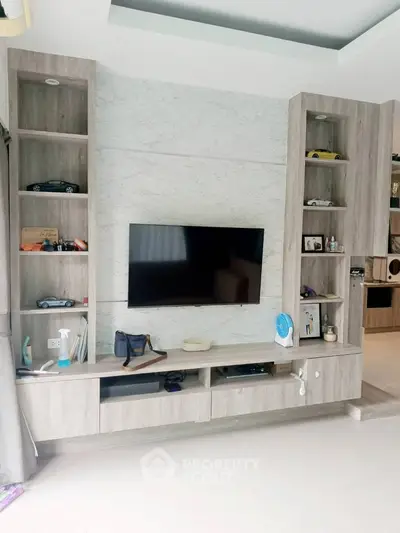 Modern living room with sleek TV unit and stylish decor