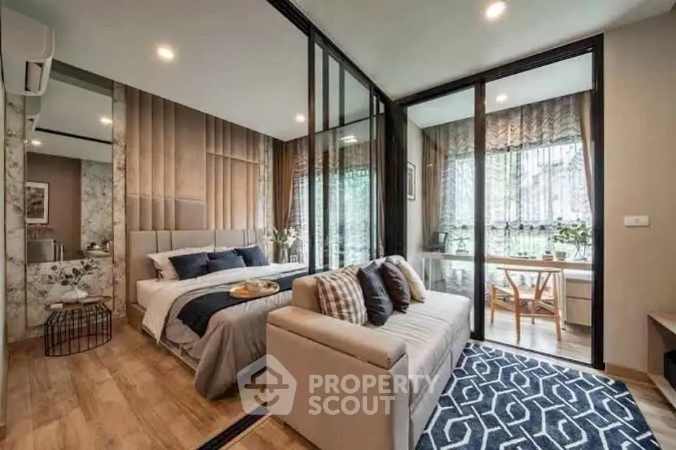 Modern bedroom with stylish decor and cozy seating area, featuring floor-to-ceiling windows and elegant design.
